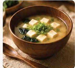 Bowl of miso soup with tofu and spring onion